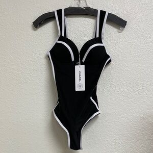 CHANEL Elegant Black Swimsuit with White Accents